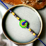 Load image into Gallery viewer, Beautiful Stone Rakhi With Peacock Design In The Center

